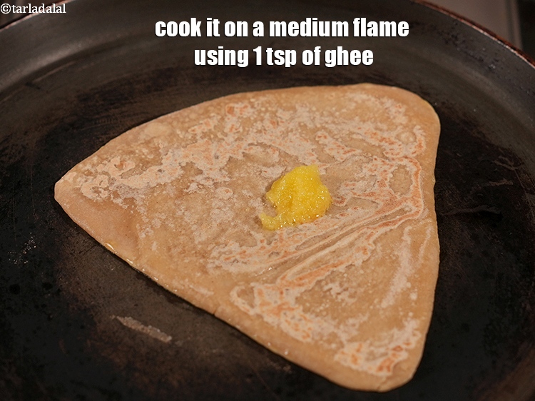 Step 24 – Cook it on a medium flame using 1 tsp of ghee.
