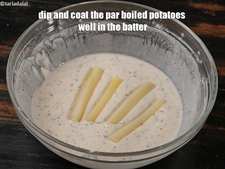 Step 22 – Dip and coat the par boiled potatoes well in the batter.