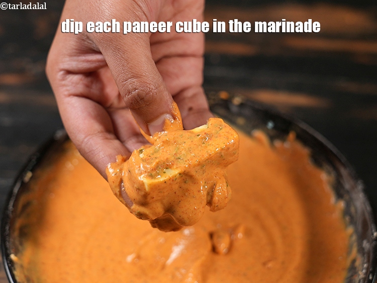 Step 21 – Dip each paneer cube in the marinade.
