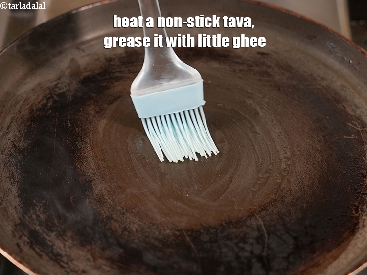 Step 21 – Heat a non-stick tava (griddle), grease it with little ghee.