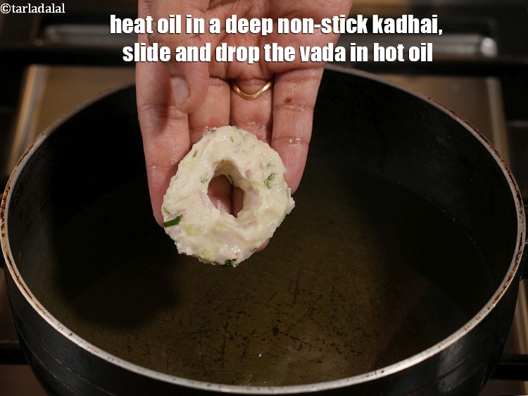 Step 21 – Heat oil in a deep non-stick kadhai, slide and drop the vada in hot oil.