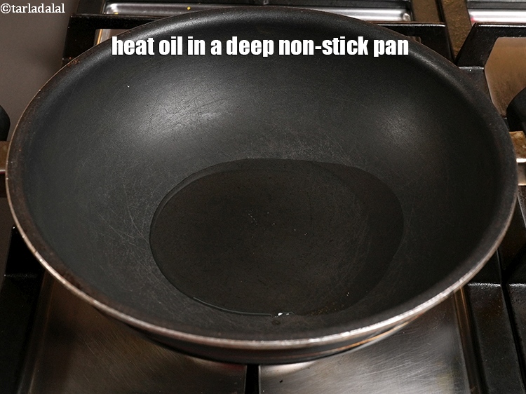 Step 21 – Heat 3 tbsp <a href="https://www.tarladalal.com/glossary-oil-671i">oil</a> in a deep non-stick pan.