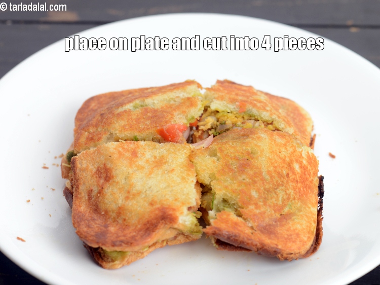 Step 22 – Place it on a plate.&nbsp;Cut into 4 equal pieces using a sharp knife.