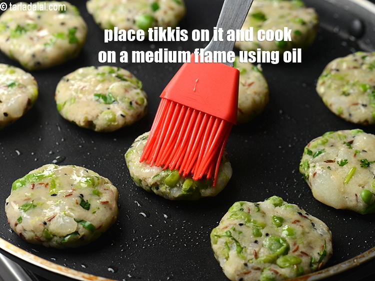 Step 19 – Place the tikkis on it and cook on a medium flame using oil till they …