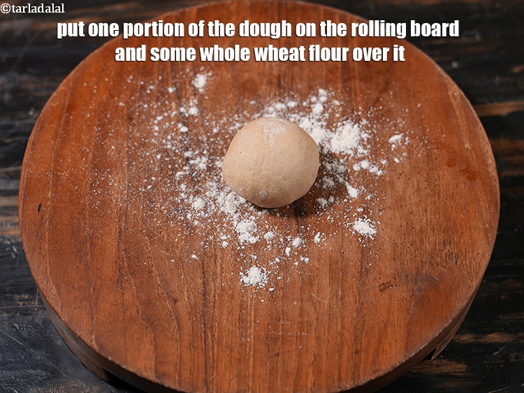 Step 24 – Put one portion of the dough on the rolling board and some whole wheat flour …