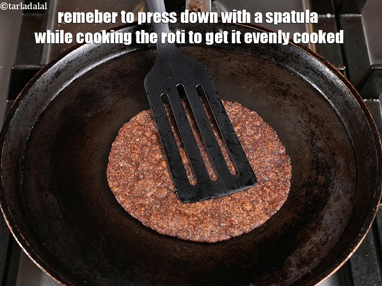 Step 23 – Remeber to press down with a spatula while cooking the roti to get it evenly …