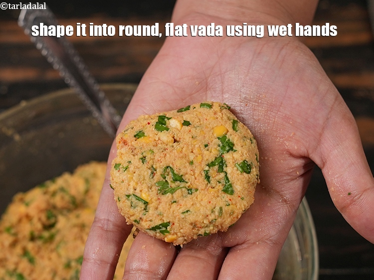 Step 21 – Shape it into round, flat vada using wet hands.