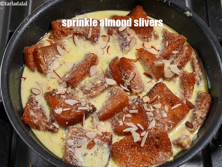 Step 21 – Sprinkle some <a href="https://www.tarladalal.com/glossary-almond-slivers-slivered-almonds-664i">almond (badam) slivers</a>.