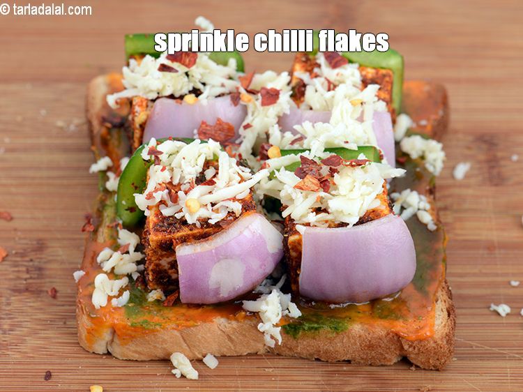 Step 21 – Sprinkle little <a href="https://www.tarladalal.com/glossary-dry-red-chilli-flakes-paprika-338i">dry red chilli flakes (paprika)</a>&nbsp;.