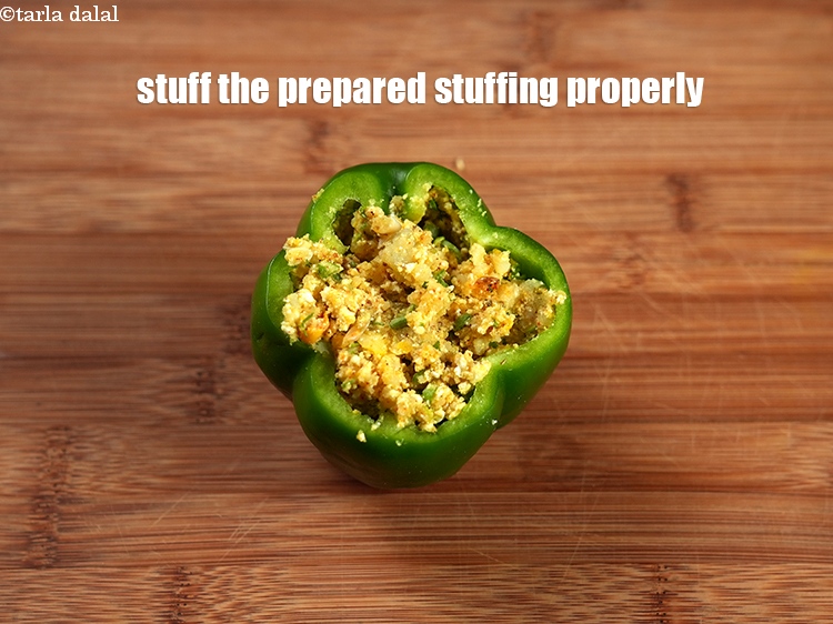 Step 21 – Stuff the prepared stuffing properly inside each cavity of the capsicum.&nbsp;