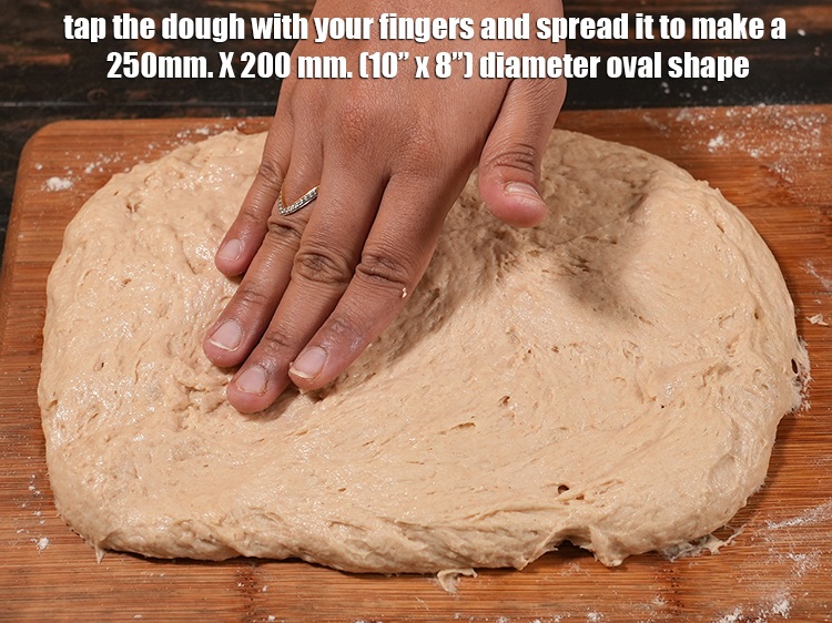 स्टेप 20 – आटे को अपनी हथेली से थपथपा कर २५० मि। मी। …