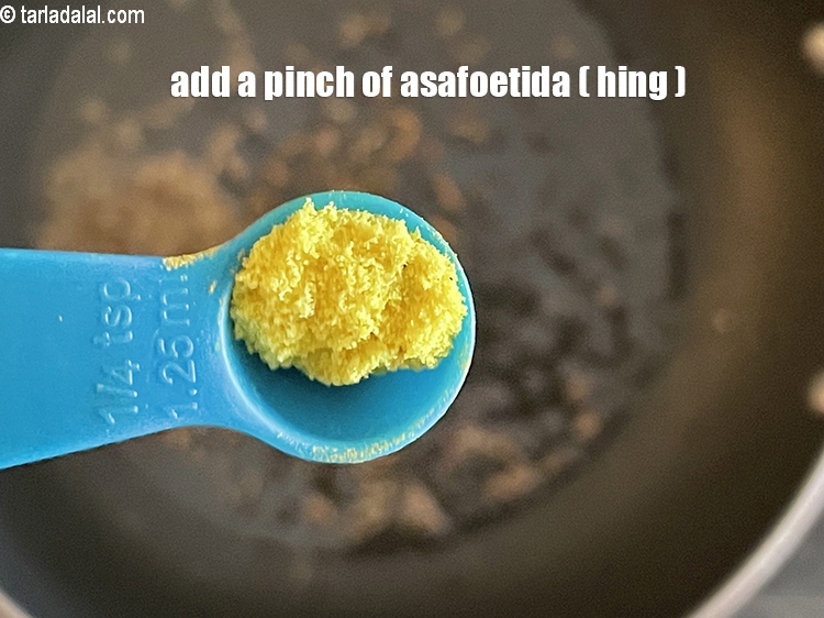 Step 23 – Add&nbsp;<meta charset="UTF-8" />a pinch of&nbsp;<a href="glossary-asafoetida-hing-113i">asafoetida (hing)</a>.