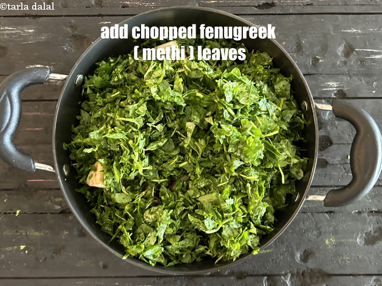 Step 22 – Add&nbsp;<meta charset="UTF-8" />2 cups&nbsp;<a href="glossary-chopped-fenugreek-811i">chopped fenugreek (methi) leaves</a>.