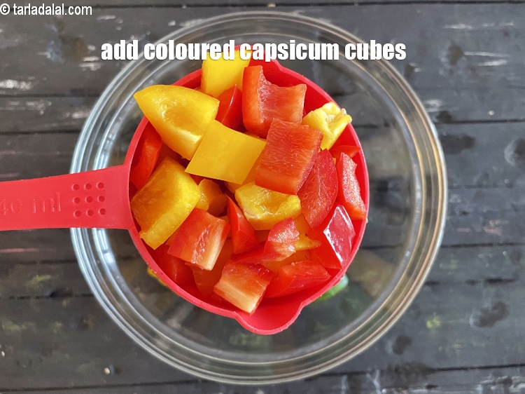 Step 25 – Add&nbsp;<meta charset="UTF-8" />1 cup&nbsp;coloured&nbsp;<a href="glossary-capsicum-cubes-170i">capsicum cubes</a>.