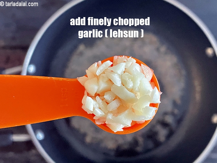 Step 21 – Add&nbsp;<meta charset="UTF-8" />1 tsp&nbsp;finely&nbsp;<a href="glossary-chopped-garlic-790i">chopped garlic (lehsun)</a>.