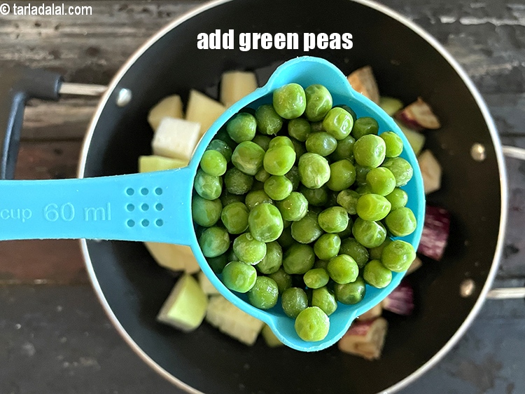Step 22 – Add&nbsp;<meta charset="UTF-8" />1/2 cup&nbsp;<a href="glossary-green-peas-matar-hare-matar-vatana-180i">green peas</a>.