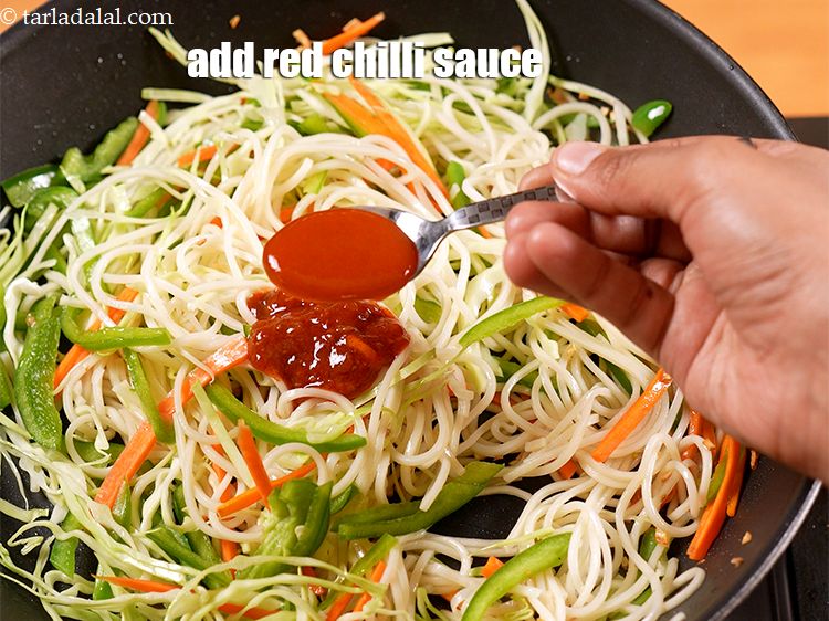 Step 22 – Add 2 tsp <a href="https://www.tarladalal.com/glossary-red-chilli-sauce-lal-chilli-sauce-810i">red chilli sauce</a>.