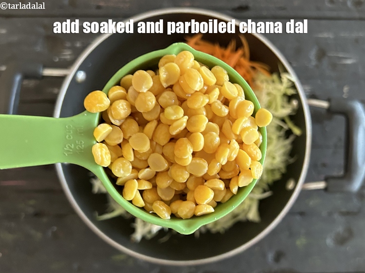 Step 22 – Add&nbsp;<meta charset="UTF-8" />1/2 cup <strong><a href="https://www.tarladalal.com/glossary-soaked-and-parboiled-chana-dal--2338i">soaked and parboiled chana dal (split bengal gram)</a>.&nbsp;</strong>See above on …