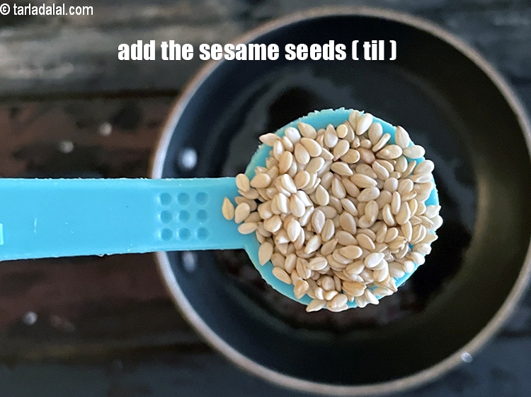 Step 21 – Add&nbsp;<meta charset="UTF-8" />1/2 tsp&nbsp;<a href="glossary-sesame-seeds-til-gingelly-seeds-612i">sesame seeds (til)</a>.