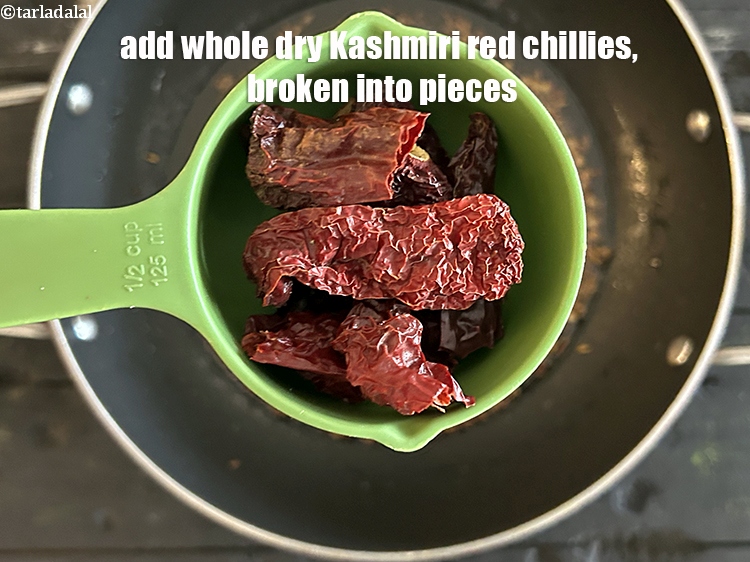 Step 21 – <html><head></head><body><p>Add&nbsp;5&nbsp;<a href="glossary-whole-dry-kashmiri-red-chillies-kashmiri-mirch-kashmiri-lal-mirch-332i">whole dry kashmiri red chillies</a>&nbsp;, broken into pieces.</p></body></html>