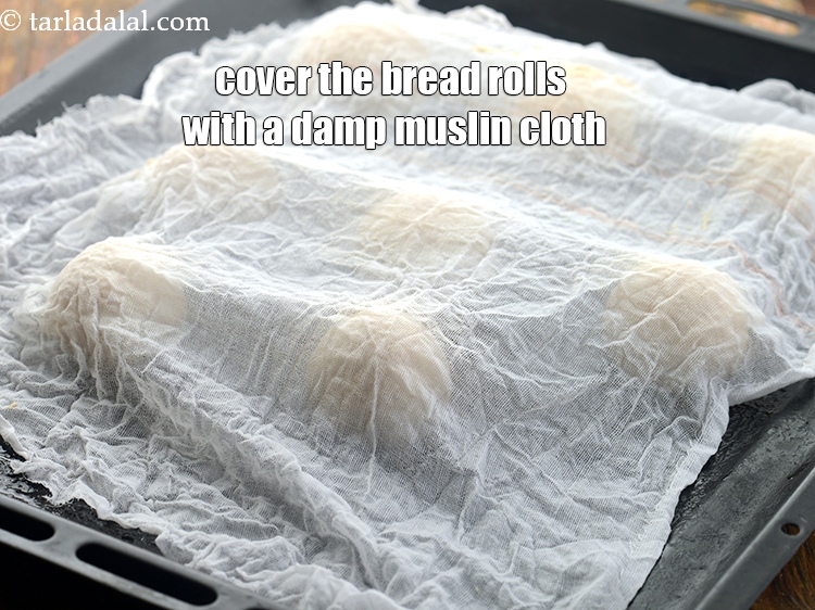 Step 20 – Cover the <strong>bread rolls</strong> with a damp muslin cloth or plastic sheet fully but ensure …