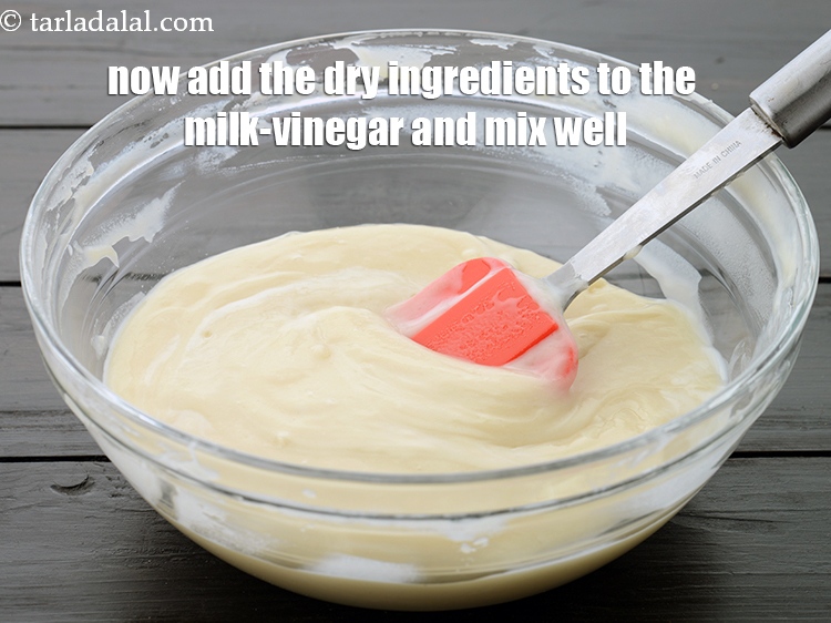 Step 21 – Now add the dry ingredients to the milk-vinegar mixture and mix well using a spatula.&nbsp;