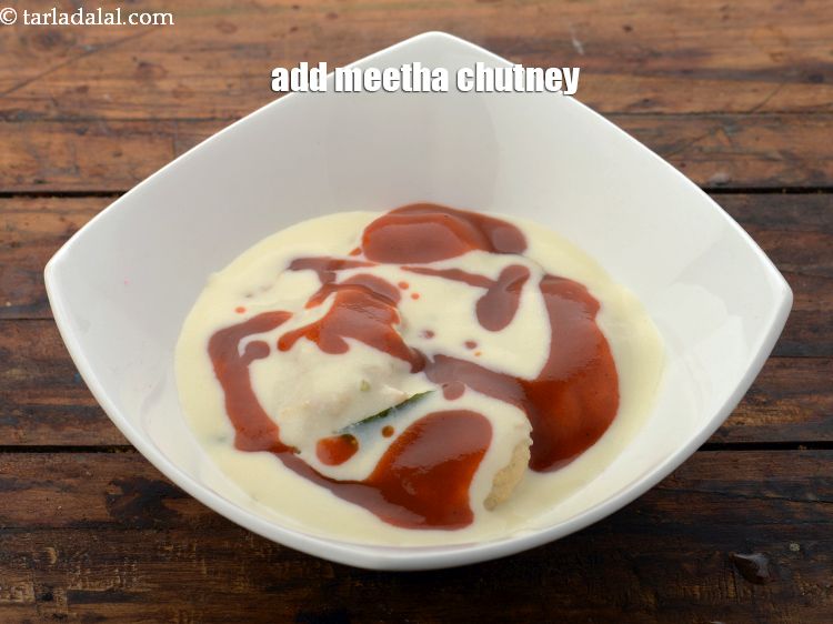 Step 53 – Put 1 tbsp <a href="https://www.tarladalal.com/khajur-imli-ki-chutney-22265r" target="_blank">meetha chutney</a>.