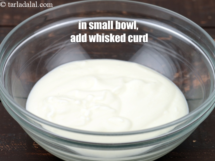 Step 22 – In a small bowl, add 1 cup whisked <a href="https://www.tarladalal.com/glossary-curd-dahi-yogurt-yoghurt-383i">curd (dahi)</a>.