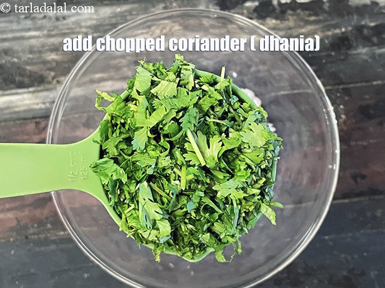 Step 22 – Add&nbsp;<meta charset="UTF-8" />1/2 cup&nbsp;chopped&nbsp;<a href="glossary-coriander-dhania-kothmir-369i">coriander (dhania)</a>.