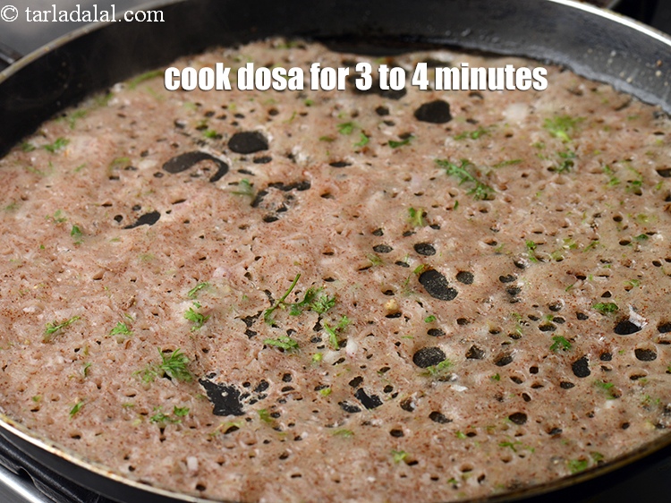 Step 21 – Cook the dosa on medium flame for 3 to 4 minutes or till crisp.&nbsp;