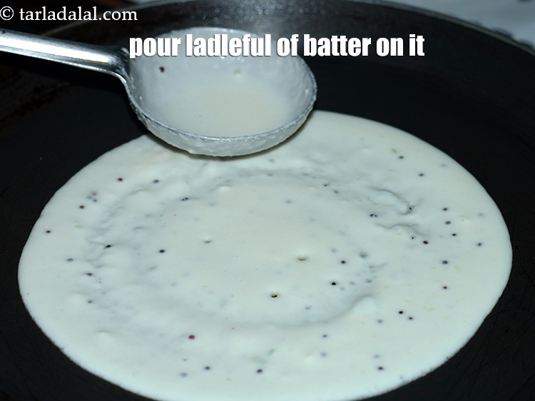 Step 21 – Pour a ladleful of the batter on it.