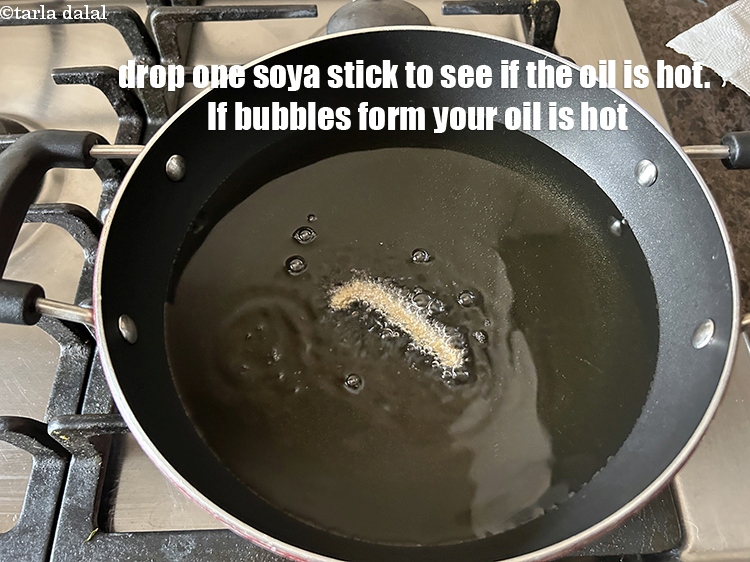 Step 22 – Drop one stick in to see if the oil is hot. Bubbles will form if …
