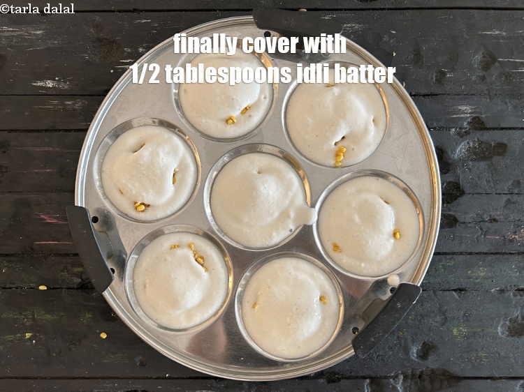 Step 21 – Finally cover the stuffing with &frac12; tbsp of the idli batter.