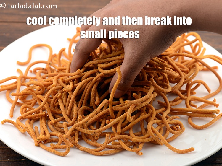 Step 21 – Let the gathia cool completely and then break into small pieces using your hands.&nbsp; &nbsp; …