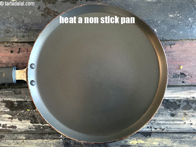 Step 22 – Heat a non-stick tava (griddle).