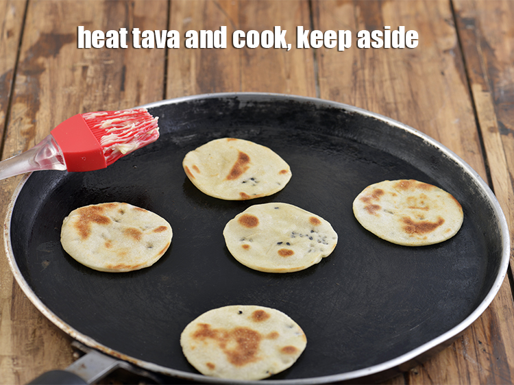 Step 25 – Heat a non-stick tava (griddle) and cook the naan on one side till it puffs …
