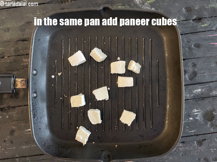 Step 22 – In the same pan, add the&nbsp;<meta charset="UTF-8" />1/4 cup&nbsp;<a href="glossary-paneer-cubes-cottage-cheese-cubes-1002i">paneer (cottage cheese) cubes</a>.