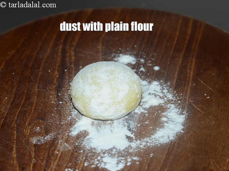 Step 24 – Dust with little plain flour.