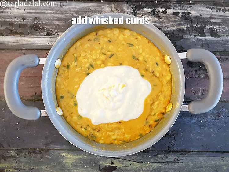 Step 28 – Add&nbsp;<meta charset="UTF-8" />3/4 cup&nbsp;<a href="glossary-whisked-curds--2096i">whisked curds (dahi)</a>.