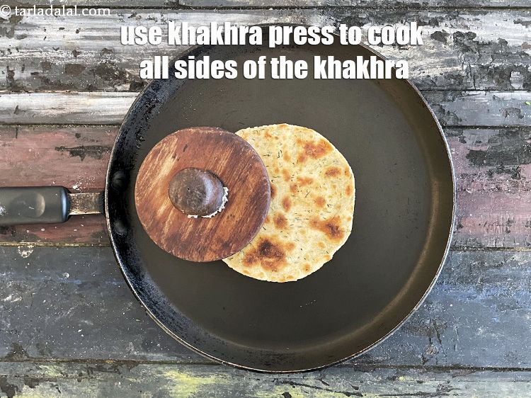 Step 23 – With the help of a khakhra press or &nbsp;folded muslin cloth, press the khakhra from …
