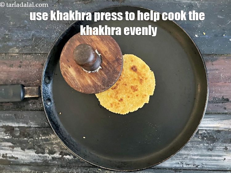 Step 25 – With the help of a khakhra press or &nbsp;folded muslin cloth, press the khakhra from …