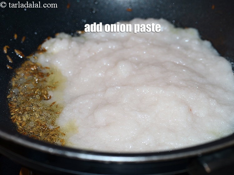 Step 22 – When the seeds crackle, add &frac34; cup <a href="https://www.tarladalal.com/glossary-onion-paste-pyaaz-ki-paste-555i">onion paste</a>.