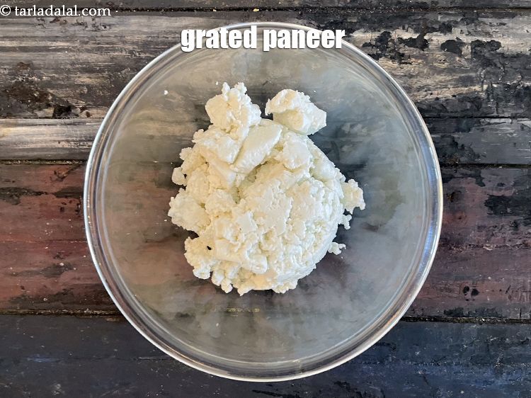 Step 32 – In a bowl put&nbsp;<meta charset="UTF-8" />1 cup&nbsp;<a href="glossary-grated-panee-1003i">grated paneer (cottage cheese)</a>.