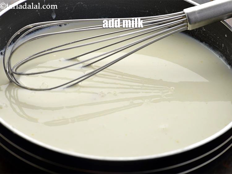 Step 24 – Add 1 cup <a href="https://www.tarladalal.com/glossary-milk-doodh-full-cream-milk-514i">milk</a>.