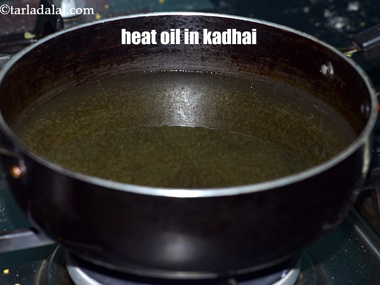 Step 22 – Heat oil in a kadhai.
