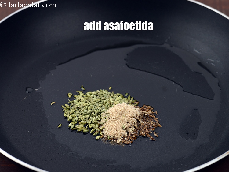 Step 20 – Add &frac14; tsp <a href="https://www.tarladalal.com/glossary-asafoetida-hing-113i">asafoetida (hing)</a>.