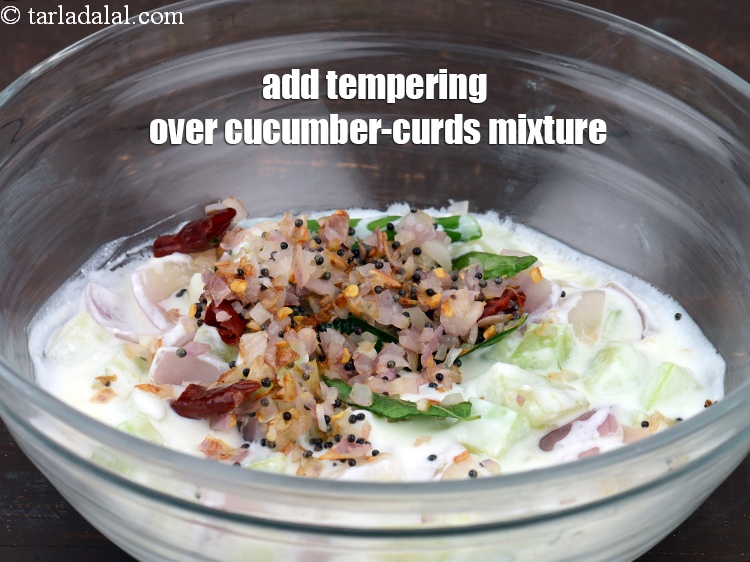 Step 21 – Add the tempering over the cucumber-curds mixture.
