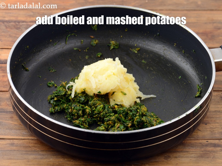 Step 22 – Add 1&nbsp;cup&nbsp;boiled and&nbsp;<a href="https://www.tarladalal.com/glossary-boiled-and-mashed-potatoes-1831i">mashed potatoes</a>.