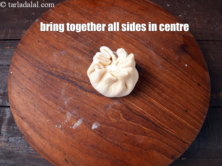 Step 21 – Bring together all the sides in the centre.