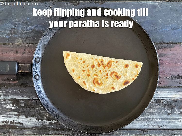 Step 39 – Keep flipping and cooking the paratha till golden brown. Your roti is ready.